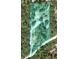 An overhead shot of the property reveals a large lot, mature trees and a private, tranquil setting at 2772 Indian Pipes Trl, Frostproof, FL 33843