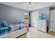 Charming bedroom with tile floors, neutral walls, and closet at 2772 Indian Pipes Trl, Frostproof, FL 33843