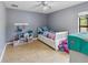 Bright bedroom features tile floors, a ceiling fan, and closet at 2772 Indian Pipes Trl, Frostproof, FL 33843