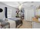 Comfortable bedroom featuring tile floors, large closet, and chandelier lighting at 2772 Indian Pipes Trl, Frostproof, FL 33843