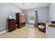 Additional bedroom with tile floors and natural light at 2772 Indian Pipes Trl, Frostproof, FL 33843