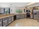 Bright eat-in kitchen features stainless steel appliances, custom cabinets, and a large window at 2772 Indian Pipes Trl, Frostproof, FL 33843