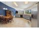 Open kitchen featuring stainless steel appliances, tile floors, and a breakfast nook at 2772 Indian Pipes Trl, Frostproof, FL 33843