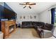 Inviting living room with tile floors, cozy fireplace, and comfortable seating area at 2772 Indian Pipes Trl, Frostproof, FL 33843