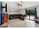 Open living room featuring tile floors, a ceiling fan, and sliding glass doors to the outside at 2772 Indian Pipes Trl, Frostproof, FL 33843