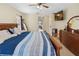Bright main bedroom featuring neutral walls, tile flooring, and a view into an adjacent hall at 2772 Indian Pipes Trl, Frostproof, FL 33843