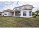 Two story house with large covered patio and backyard at 3526 Valleyview Dr, Kissimmee, FL 34746