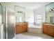 Large bathroom with double vanity and tub at 3526 Valleyview Dr, Kissimmee, FL 34746