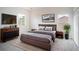 Bedroom with a brown upholstered bed and window views at 3526 Valleyview Dr, Kissimmee, FL 34746