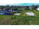 Community playground with play structures and sand volleyball court at 3526 Valleyview Dr, Kissimmee, FL 34746