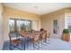 Covered patio with table, chairs, and sliding glass doors at 3526 Valleyview Dr, Kissimmee, FL 34746
