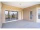Empty covered patio with sliding glass doors at 3526 Valleyview Dr, Kissimmee, FL 34746