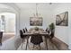Modern dining room featuring a concrete table and six brown chairs at 3526 Valleyview Dr, Kissimmee, FL 34746
