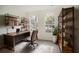 Home office features built-in shelving and a large wood desk at 3526 Valleyview Dr, Kissimmee, FL 34746