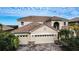 Two-story house with tile roof and double garage at 3526 Valleyview Dr, Kissimmee, FL 34746