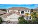 Two-story house with tile roof and double garage at 3526 Valleyview Dr, Kissimmee, FL 34746