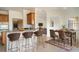 Open concept kitchen with island and breakfast bar seating at 3526 Valleyview Dr, Kissimmee, FL 34746