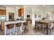 Open concept kitchen with island and breakfast bar seating at 3526 Valleyview Dr, Kissimmee, FL 34746