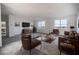 Relaxing living room with brown leather furniture and a view at 3526 Valleyview Dr, Kissimmee, FL 34746