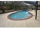 Enclosed private pool with a spa, surrounded by a concrete patio, providing an ideal space for outdoor entertainment at 3710 Black Jack Ct, Lake Wales, FL 33898