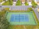 Community tennis court with green surrounding at 4004 Cypress Lndg S, Winter Haven, FL 33884