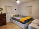 Bedroom with a queen-size bed and wood dresser at 4105 Oak Dr, Winter Haven, FL 33881