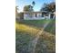 Ranch-style home with a spacious lawn and attached garage at 4105 Oak Dr, Winter Haven, FL 33881