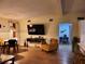 Open living area featuring a large TV and dining space at 4105 Oak Dr, Winter Haven, FL 33881