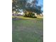 Side yard with chain link fence and large oak tree at 4105 Oak Dr, Winter Haven, FL 33881