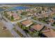Aerial view of a house nestled in a quiet residential neighborhood at 4195 Muirfield Loop, Lake Wales, FL 33859