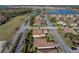 Aerial view of house situated in a tranquil residential community at 4195 Muirfield Loop, Lake Wales, FL 33859