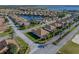Aerial view of single-story home in a residential community at 4195 Muirfield Loop, Lake Wales, FL 33859