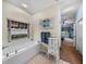 Relaxing bathroom with soaking tub, updated vanity, and view of backyard at 4195 Muirfield Loop, Lake Wales, FL 33859