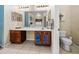 Bathroom with a large vanity, toilet, and linen storage at 4195 Muirfield Loop, Lake Wales, FL 33859