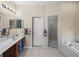 Primary bathroom with a soaking tub and shower at 4195 Muirfield Loop, Lake Wales, FL 33859