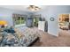 Main bedroom suite with sliding glass doors to the patio at 4195 Muirfield Loop, Lake Wales, FL 33859