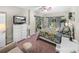 Comfortable bedroom with floral bedding, a dresser, and sliding glass doors to patio at 4195 Muirfield Loop, Lake Wales, FL 33859