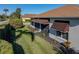 Single story house with brown awnings and well-manicured lawn at 4195 Muirfield Loop, Lake Wales, FL 33859