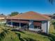 Single story house with brown awnings and well-manicured lawn at 4195 Muirfield Loop, Lake Wales, FL 33859