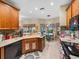 Modern kitchen with stainless steel appliances and wood cabinets at 4195 Muirfield Loop, Lake Wales, FL 33859