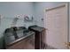 Convenient laundry room with washer, dryer, and ample storage at 4195 Muirfield Loop, Lake Wales, FL 33859