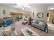 Open concept living area with comfortable seating, and access to a patio at 4195 Muirfield Loop, Lake Wales, FL 33859