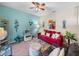 Cozy living room with red couch and decorative accents at 4195 Muirfield Loop, Lake Wales, FL 33859