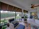 Relaxing screened porch with wicker furniture and view at 4195 Muirfield Loop, Lake Wales, FL 33859