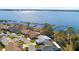 Aerial view of house and neighborhood by the lake at 462 Sweetwater Way, Haines City, FL 33844