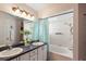 Bathroom with double vanity and a tub at 462 Sweetwater Way, Haines City, FL 33844