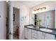 Bathroom with double vanity and access to bedroom at 462 Sweetwater Way, Haines City, FL 33844