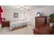 Spacious bedroom with a king-size bed and wood furniture at 462 Sweetwater Way, Haines City, FL 33844