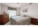 Serene bedroom with a king-size bed and light green bedding at 462 Sweetwater Way, Haines City, FL 33844