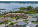 Community clubhouse with tennis courts and lake view at 462 Sweetwater Way, Haines City, FL 33844